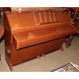 An Eavestaff pianette upright mini piano and stool