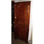 A Georgian style mahogany full-height corner cupboard, integral dentil moulded cornice above two