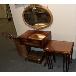 A reproduction sofa table; a nest of three tables; a gilt framed mirror (a.f); a Lloyd Loom linen