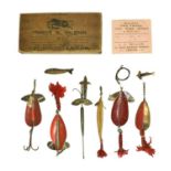 A Francis M Walbran Brown Trade Card Box containing a selection of various lures and Colorado type