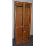 A Custom Built Sportsman's Cabinet in oak with glazed doors and fitted internally for rod display/