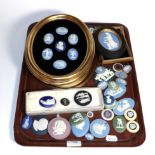 A Wedgwood Jasper ware plaque display, twelve of them decorated with the signs of the zodiac,