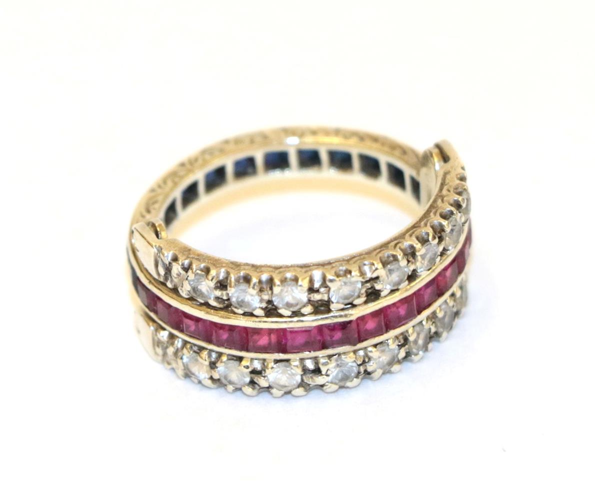 A white sapphire, synthetic ruby and synthetic sapphire swivel ring, the main band channel set in