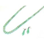 A jade bead necklace, formed of one hundred and fifteen graduated spherical jade beads, length 73cm;