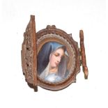 A 19th century painted porcelain portrait miniature of the Virgin Mary, unsigned, within a pierced