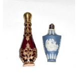 A ruby-glass scent-bottle with brass mounts, pear-shaped and with openwork and engraved foliage