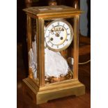 A gilt-metal and four-glass striking mantel clock with mercury pendulum