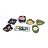 Thirteen various Walter Moorcroft card trays, ashtrays, coasters and a rectangular dish, in