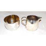 A George III silver cream-jug, London 1795 and a Victorian silver sugar-basin, London 1888, 9oz (2)