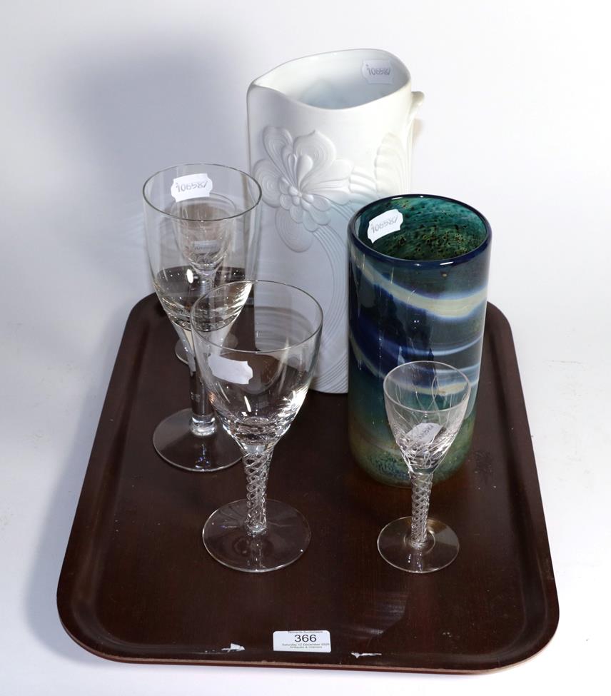 A Kaiser porcelain floral vase; an Art glass vase; three Stuart stemmed glasses; and another (6)