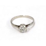 A diamond solitaire ring, the old cut diamond in a white claw setting, to a tapered shoulder plain