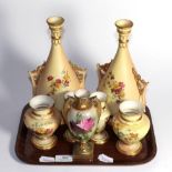 A pair of Royal Worcester blush ivory twin handled vases, two further pairs of Royal Worcester blush