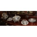 A pair of silver plated tureens and covers, three plated entree dishes, a plated tray, a Walker &