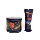 A William Moorcroft Pansy pattern vase, on a dark blue ground, impressed marks, green painted