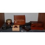 An early 20th century oak stationery cabinet with tambour top; an oak biscuit barrel with plated