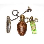 Three scent-bottles, one of adventurine glass with brass mounts; another green glass, heightened