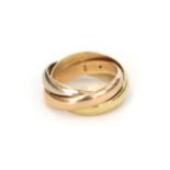 A Trinity ring, by Cartier, three entwined yellow, rose and white bands, finger size F1/2. The