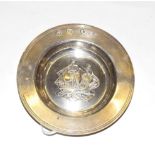 A silver Armada dish, marked for London, the centre repousse decorated with a triple-masted ship,