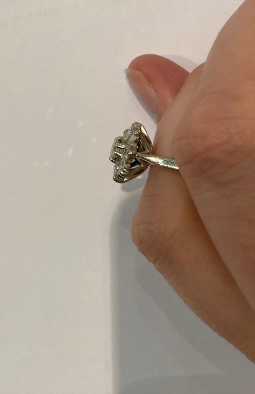 A diamond cluster ring, the round brilliant cut diamond within a border of smaller round brilliant - Image 8 of 12