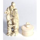 A 19th century Japanese ivory figure group, 16cm high, and a circular box, 7cm high . Combined