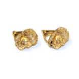 A pair of lion mask earrings, with clip fittings . Stamped 'K14'. Gross weight 7.9 grams.