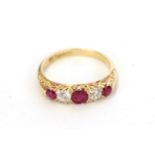 A synthetic ruby and diamond five stone ring, three graduated round cut synthetic rubies alternate