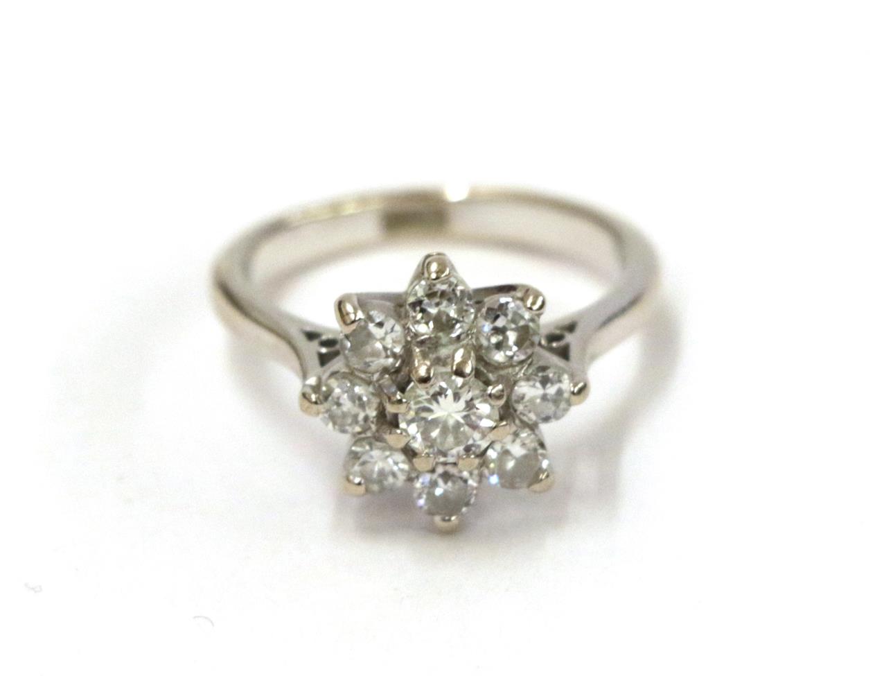 A diamond cluster ring, the round brilliant cut diamond within a border of smaller round brilliant - Image 2 of 12
