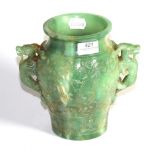 A carved green hardstone twin-handled vase with Oriental design, 20cm high