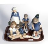 Four Royal Copenhagen figures, model numbers; 815, 1747, 3468 and 1314 together with a Bing &