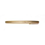 A 9 carat gold ballpoint pen, with engine turned decoration throughout, length 12.5cm . Gross weight