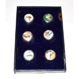 A set of six Elizabeth II silver and enamel boxes, by The St. James's House Collection, London,