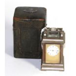 A small brass carriage timepiece, in fitted case, inside fitted case, lid marked Howell James & Co.,