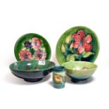 Group of Walter Moorcroft Pottery, all on green grounds, various patterns, including African Lily,