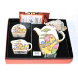 A boxed Wedgwood 'Bizarre by Clarice Cliff' Bonjour coffee set
