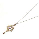 An early 20th century pink stone and split pearl pendant on chain, the central round cut pink