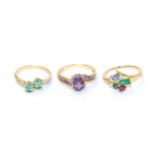 Three 9 carat gold gem set rings comprising of an amethyst and diamond cluster ring, finger size