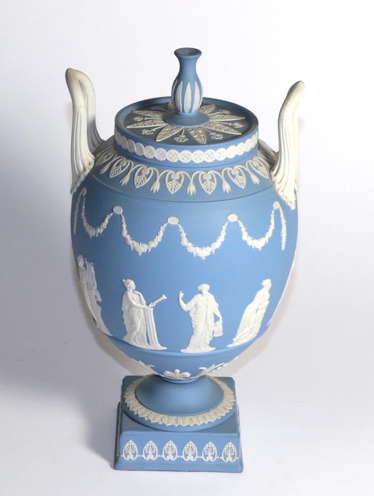 A Wedgwood blue Jasper ware urn and cover decorated in the Classical taste with the Greek muses (