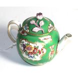 A 19th century tea pot, painted with vignettes of exotic birds on a green ground, 13cm high. Some