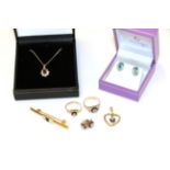 A collection of jewellery including a 9 carat gold sapphire and diamond heart pendant; a pair of 9