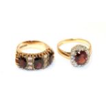 A 9 carat gold garnet and white stone ring, three oval garnets with white stone accents, in yellow