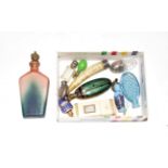 A group of assorted scent-bottles, including: a cut-glass bottle with gold and enamel cover,