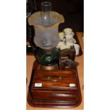 A Victorian oil lamp, a George III mahogany tea-caddy, a pair of 1930s book-ends in the form of dogs