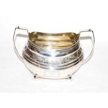 A George III silver sugar bowl, maker's mark rubbed, London, 1812, oblong and on four ball feet,