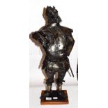A modernist metal sculpture of a drunken knight, 65cm high, unsigned