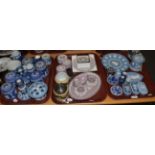 A good quantity of Wedgwood Jasper ware items including puce dressing table items, blue vases jars