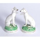 A pair of 19th century Staffordshire seated grey hounds, 11cm high