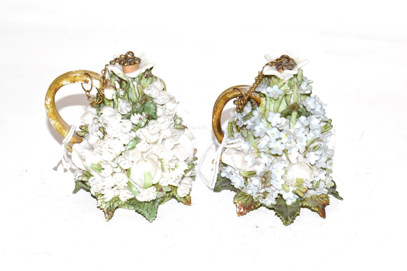 Two porcelain scent-bottles, each tapering, applied with flowers and foliage in high relief and with