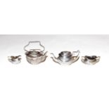 An Edward VII and Elizabeth II miniature silver toy tea-service, comprising; a kettle, by Levi and