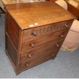 A reproduction oak four-drawer chest