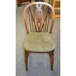 A set of six elm wheel-back Windsor chairs